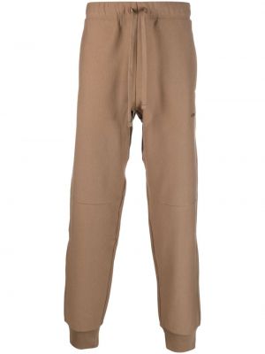 Bavlněné sportovní kalhoty s výšivkou Carhartt Wip hnědé
