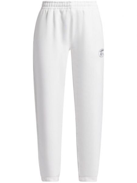 Βαμβακερό αθλητικό παντελόνι Lacoste λευκό