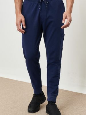 Lakierowane spodnie sportowe w kolorze melanż z kieszeniami Ac&co / Altınyıldız Classics niebieskie