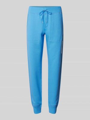 Spodnie sportowe w jednolitym kolorze Polo Ralph Lauren niebieskie