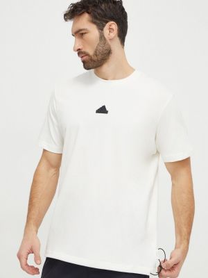 Памучна тениска с дълъг ръкав с апликация Adidas бежово