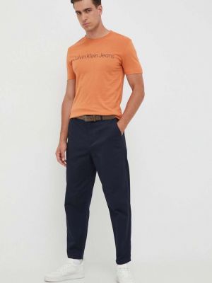Koszulka bawełniana z nadrukiem Calvin Klein Jeans pomarańczowa