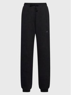 Sportovní kalhoty relaxed fit Adidas černé