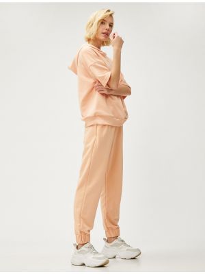 Teplákové nohavice Koton oranžová