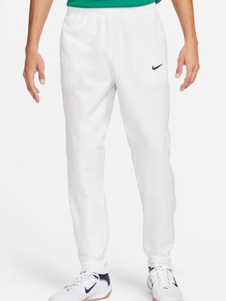 Теннисные брюки Nike белые