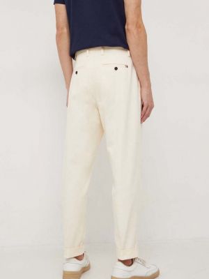 Jednobarevné kalhoty Tommy Hilfiger béžové