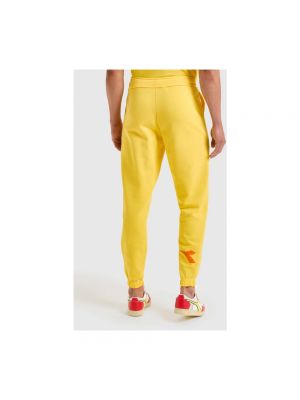 Spodnie sportowe bawełniane Diadora żółte