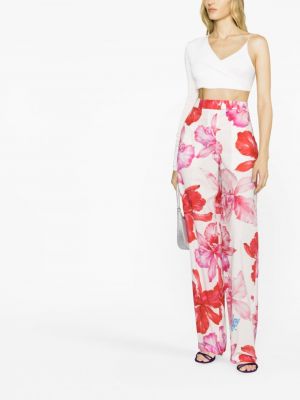 Květinové kalhoty s potiskem The Attico růžové