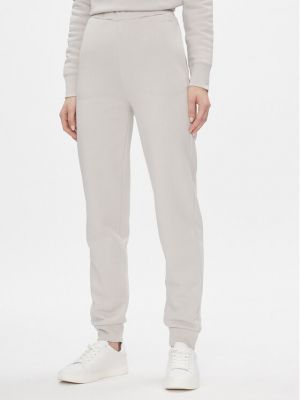 Priliehavé teplákové nohavice Calvin Klein béžová