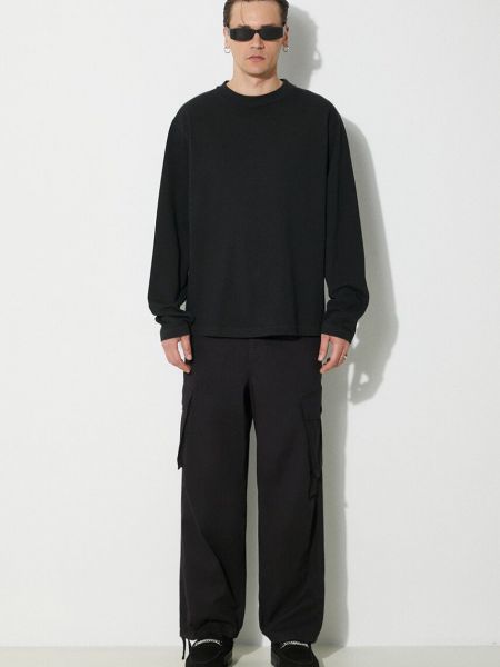 Jednobarevné bavlněné kalhoty Carhartt Wip černé