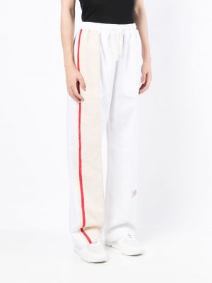 Pruhované sportovní kalhoty Marine Serre bílé