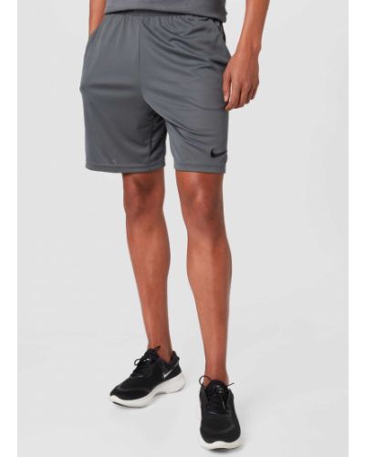 Teplákové nohavice Nike sivá