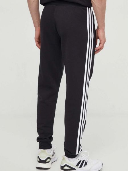 Pruhované sportovní kalhoty s aplikacemi Adidas Originals černé