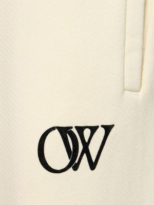 Bavlnené teplákové nohavice Off-white béžová