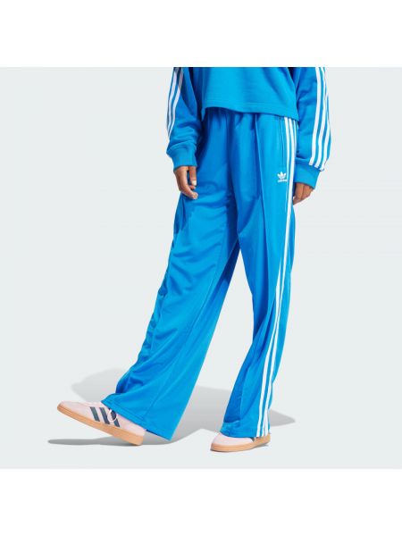Spodnie sportowe relaxed fit Adidas niebieskie