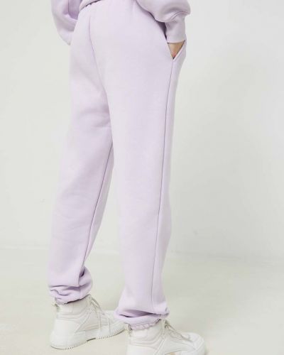 Sportovní kalhoty s aplikacemi Juicy Couture fialové