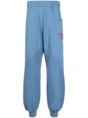 Bavlnené teplákové nohavice Jw Anderson modrá