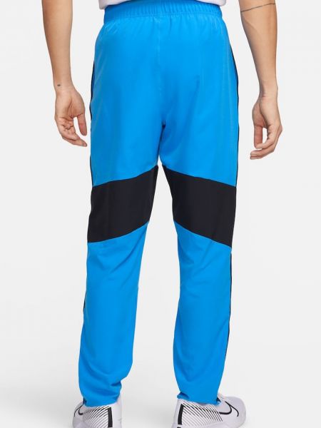 Теннисные брюки Nike синие