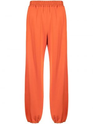 Teplákové nohavice Jil Sander oranžová