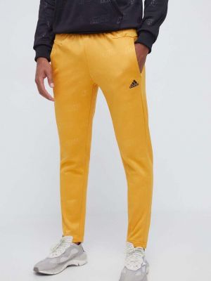 Sportovní kalhoty Adidas žluté
