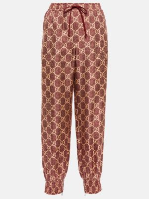 Jedwabne spodnie sportowe z nadrukiem Gucci Różowe