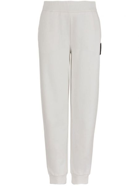 Bavlnené teplákové nohavice Armani Exchange biela