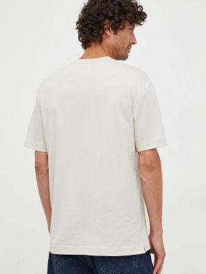 Bavlněné tričko s potiskem Calvin Klein béžové