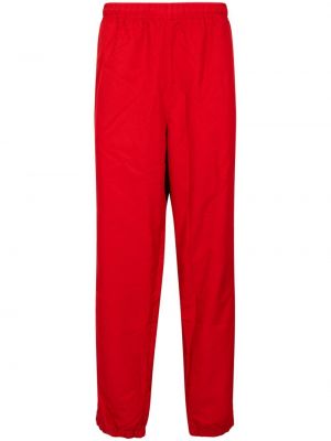 Teplákové nohavice Supreme červená