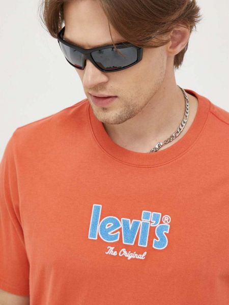 Bavlněné tričko s aplikacemi Levi's oranžové