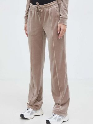 Velurové sportovní kalhoty s aplikacemi Juicy Couture béžové