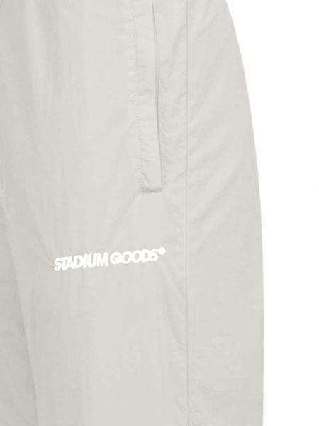 Sportovní kalhoty s výšivkou Stadium Goods šedé
