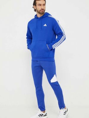 Spodnie sportowe z nadrukiem Adidas niebieskie