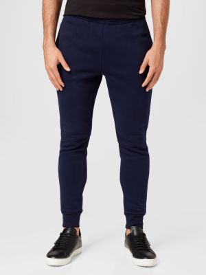 Teplákové nohavice Lacoste modrá
