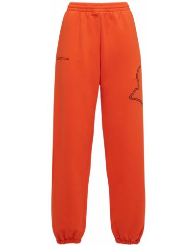 Bavlněné vzorované kalhoty s kapsami Pangaia - oranžová