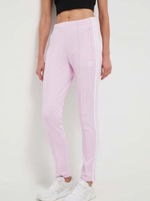 Sportovní kalhoty s aplikacemi Adidas Originals růžové