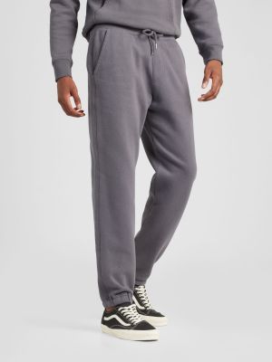 Teplákové nohavice Hollister sivá