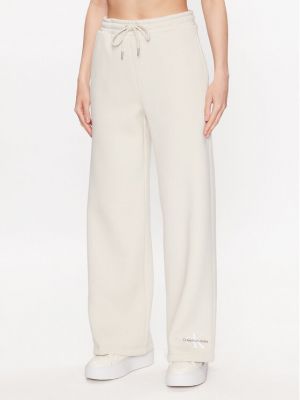 Relaxed fit sportinės kelnes Calvin Klein Jeans smėlinė