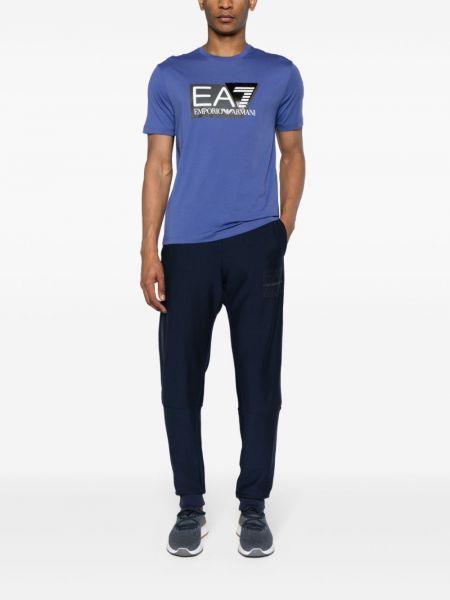 Spodnie sportowe bawełniane z nadrukiem Ea7 Emporio Armani niebieskie
