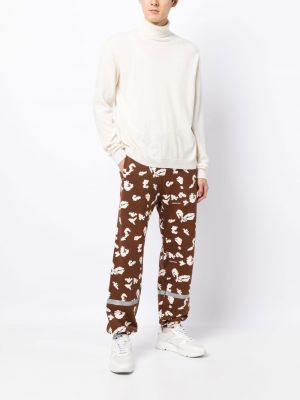 Sportovní kalhoty s potiskem s abstraktním vzorem Undercover hnědé