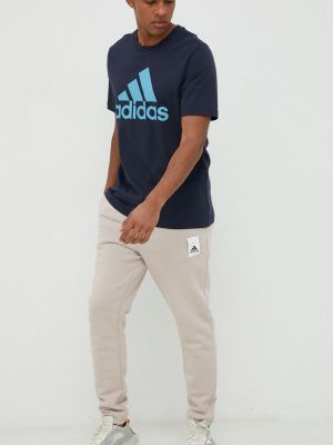 Спортивні штани з аплікацією Adidas бежеві