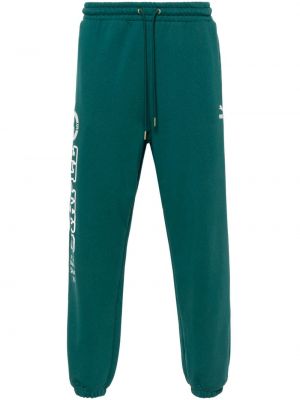 Bavlnené teplákové nohavice Puma zelená