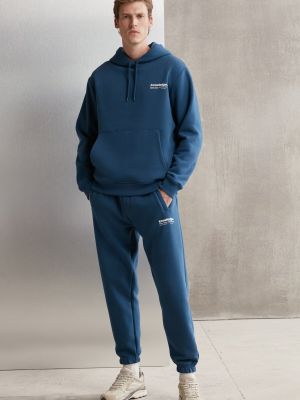 Fleecové sportovní kalhoty s kapucí s potiskem Grimelange modré