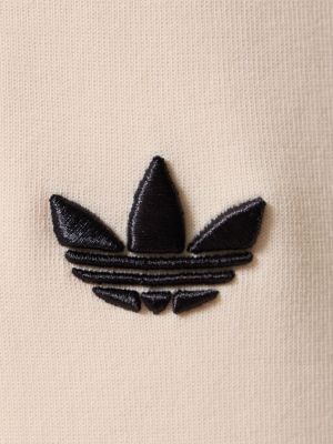 Joggery bawełniane w paski Adidas Originals beżowe
