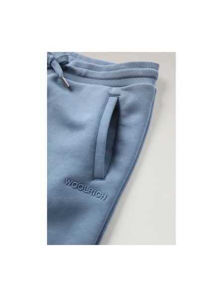 Spodnie sportowe Woolrich niebieskie