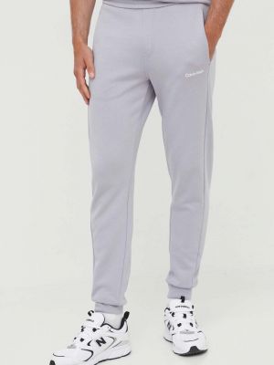 Sportovní kalhoty Calvin Klein šedé