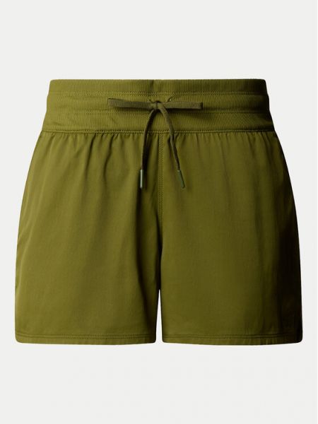 Priliehavé teplákové nohavice The North Face zelená