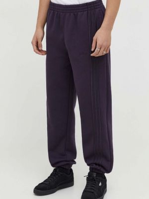 Однотонные спортивные штаны Adidas Originals фиолетовые