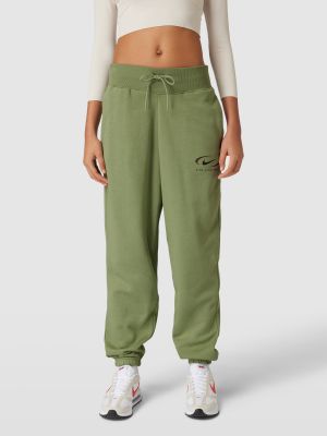 Spodnie sportowe z nadrukiem Nike zielone