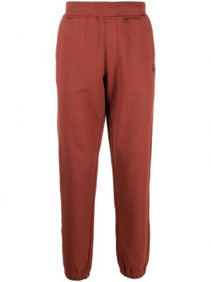 Bavlněné sportovní kalhoty s výšivkou C.p. Company oranžové