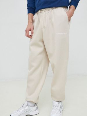 Спортивные штаны с аппликацией Calvin Klein Jeans бежевые